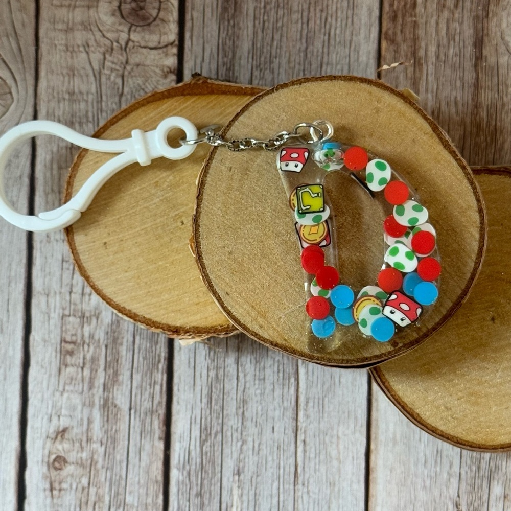 Letter D with video game inspired bag charm handcrafted newly made. 2”
